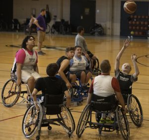 Students playing wheelchair basketball