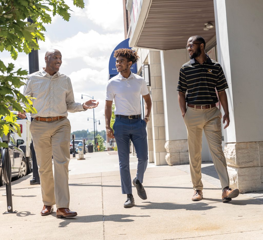 Walking through downtown Columbia, Abel Ambessie, and teo friends discuss how the Vasey Academy helped launch their academic and business careers.