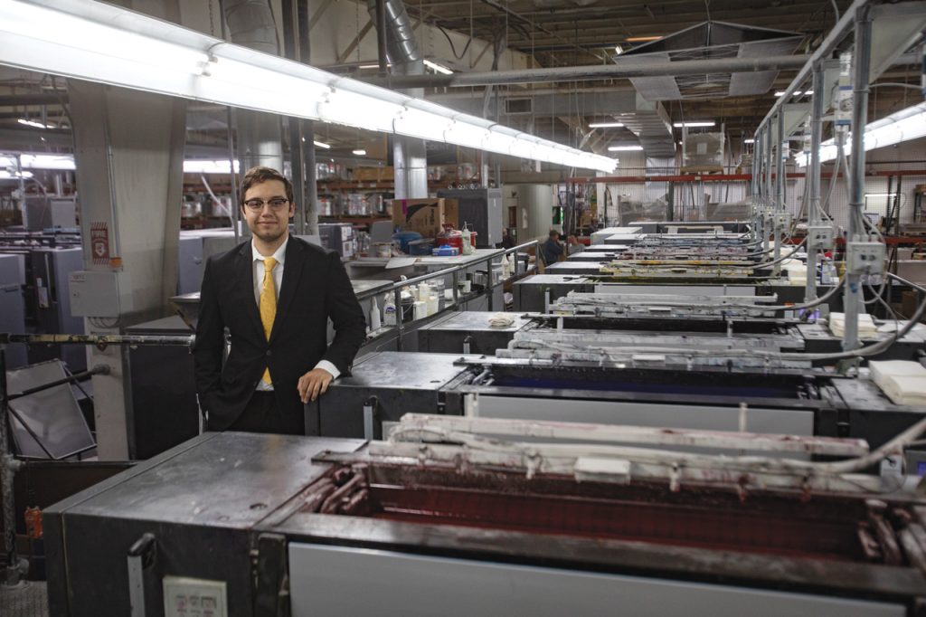 Jesus Oropeza stands in the Walsworth Publishing plant in Marceline, Missouri